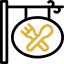 A hanging restaurant sign featuring a crossed fork and spoon icon in gold on a white circle.